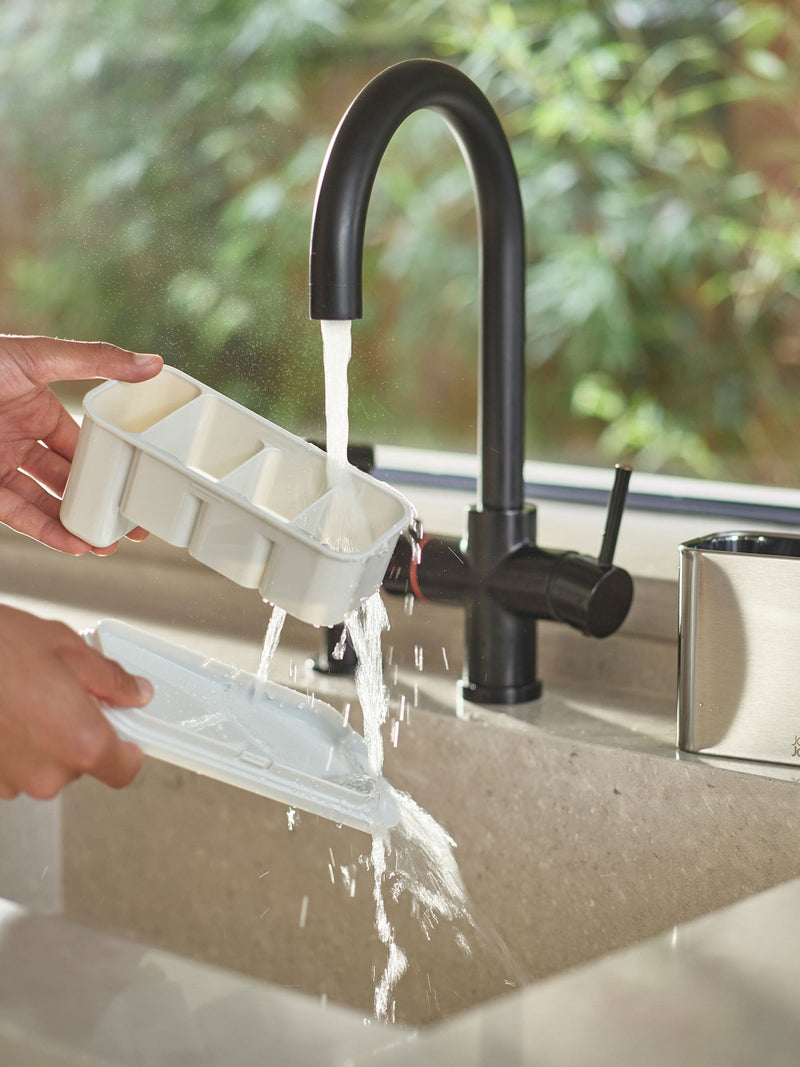 Joseph Joseph stainless-steel cutlery drainer with light stone surface, UK version