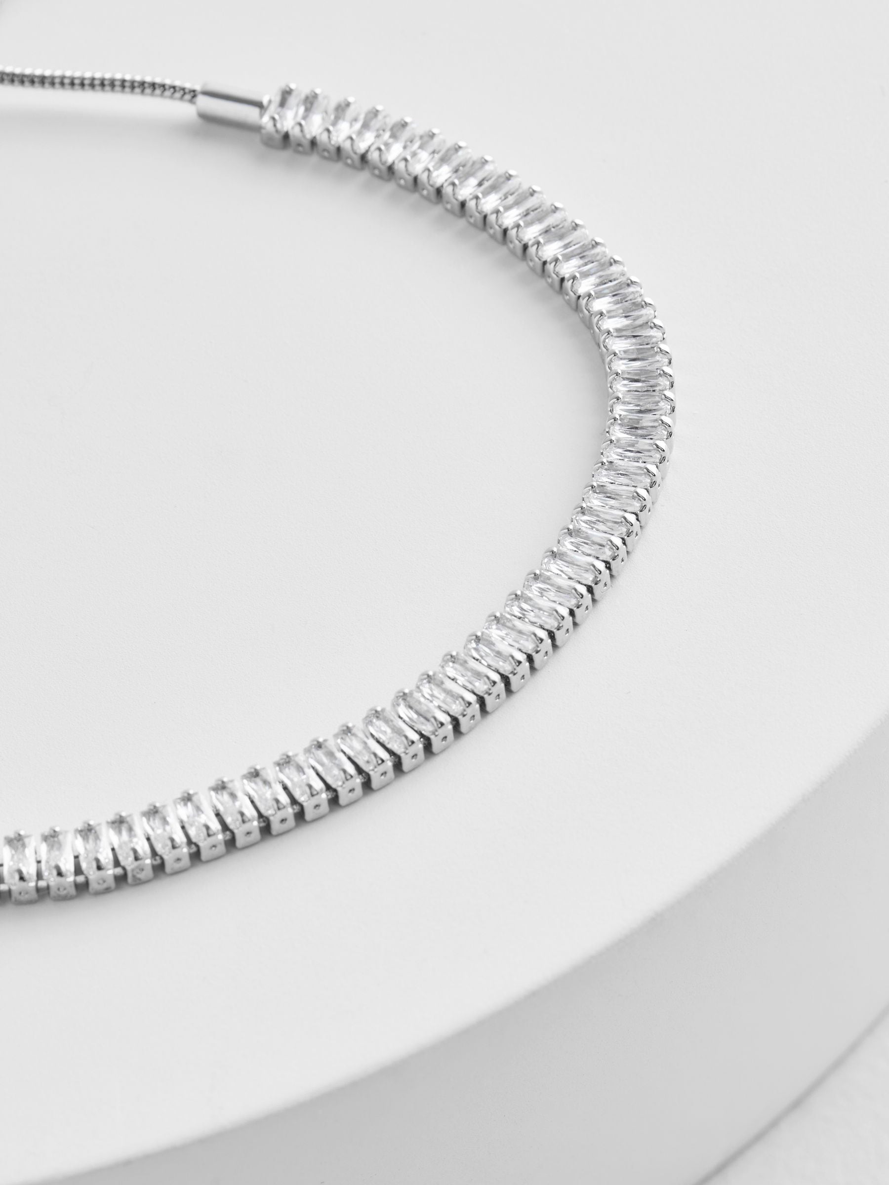Silver tone baguette stone pully bracelet (British brand)