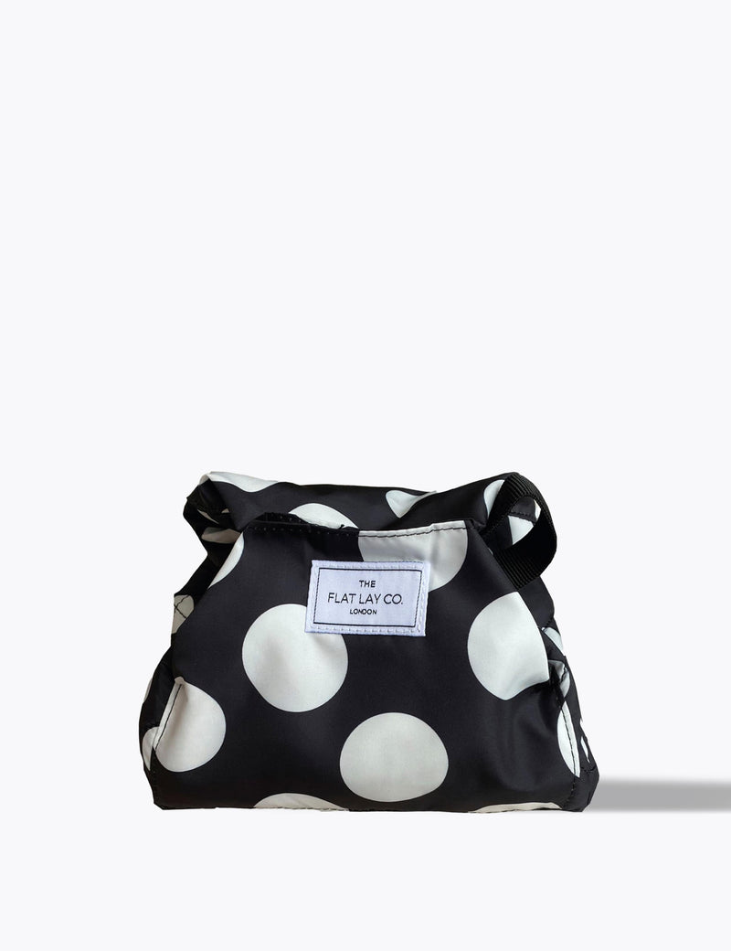 The Flat Lay Co. open flat makeup bag with double spots design, 52cm diameter, imported from the UK