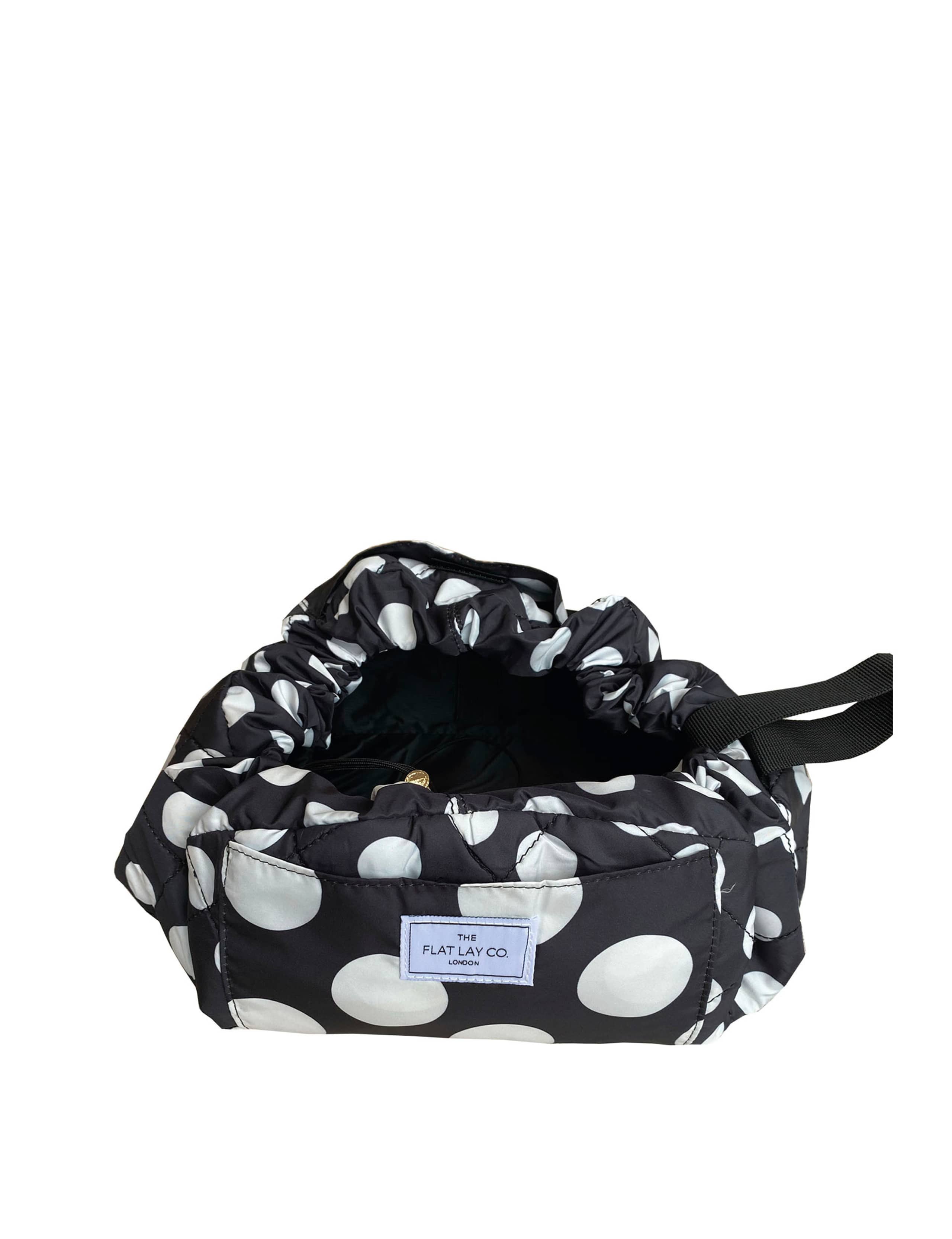 The Flat Lay Co. open flat makeup bag with double spots design, 52cm diameter, imported from the UK