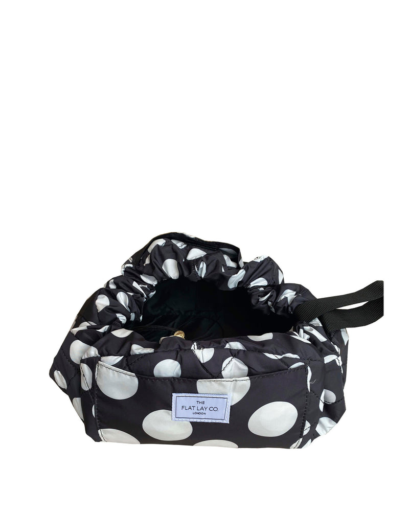 The Flat Lay Co. open flat makeup bag with double spots design, 52cm diameter, imported from the UK