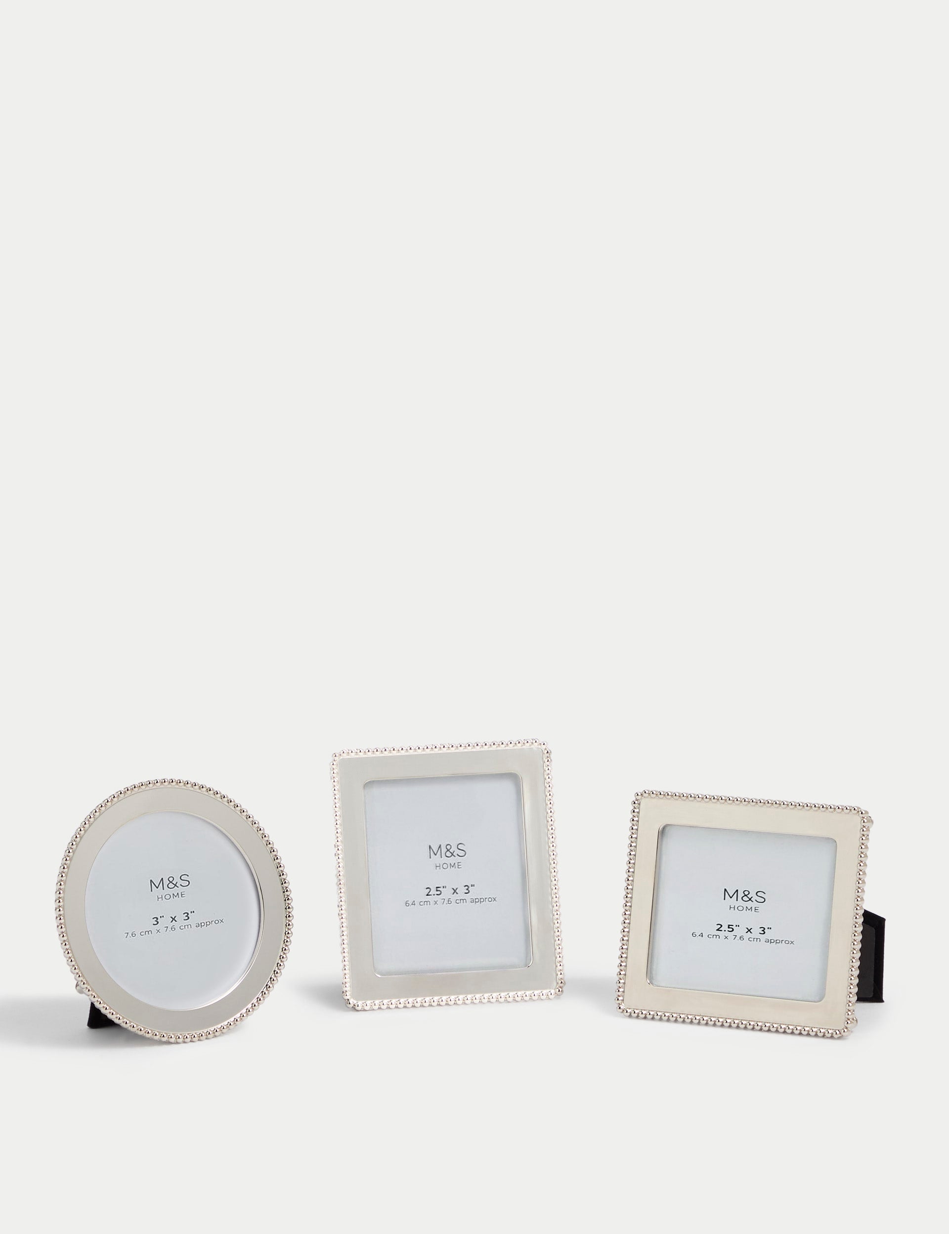 Set of three silver photo frames with square, rectangular, and circular shapes (British brand)