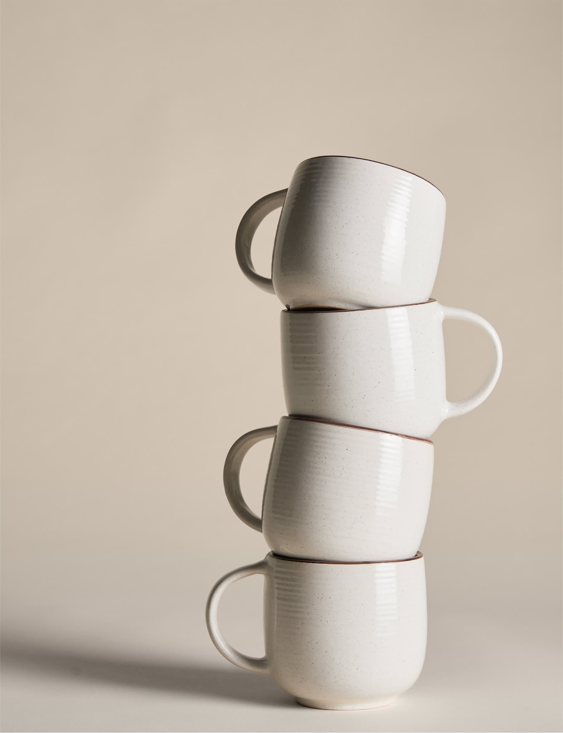 Set of four speckled ceramic mugs with contrast rims - British product