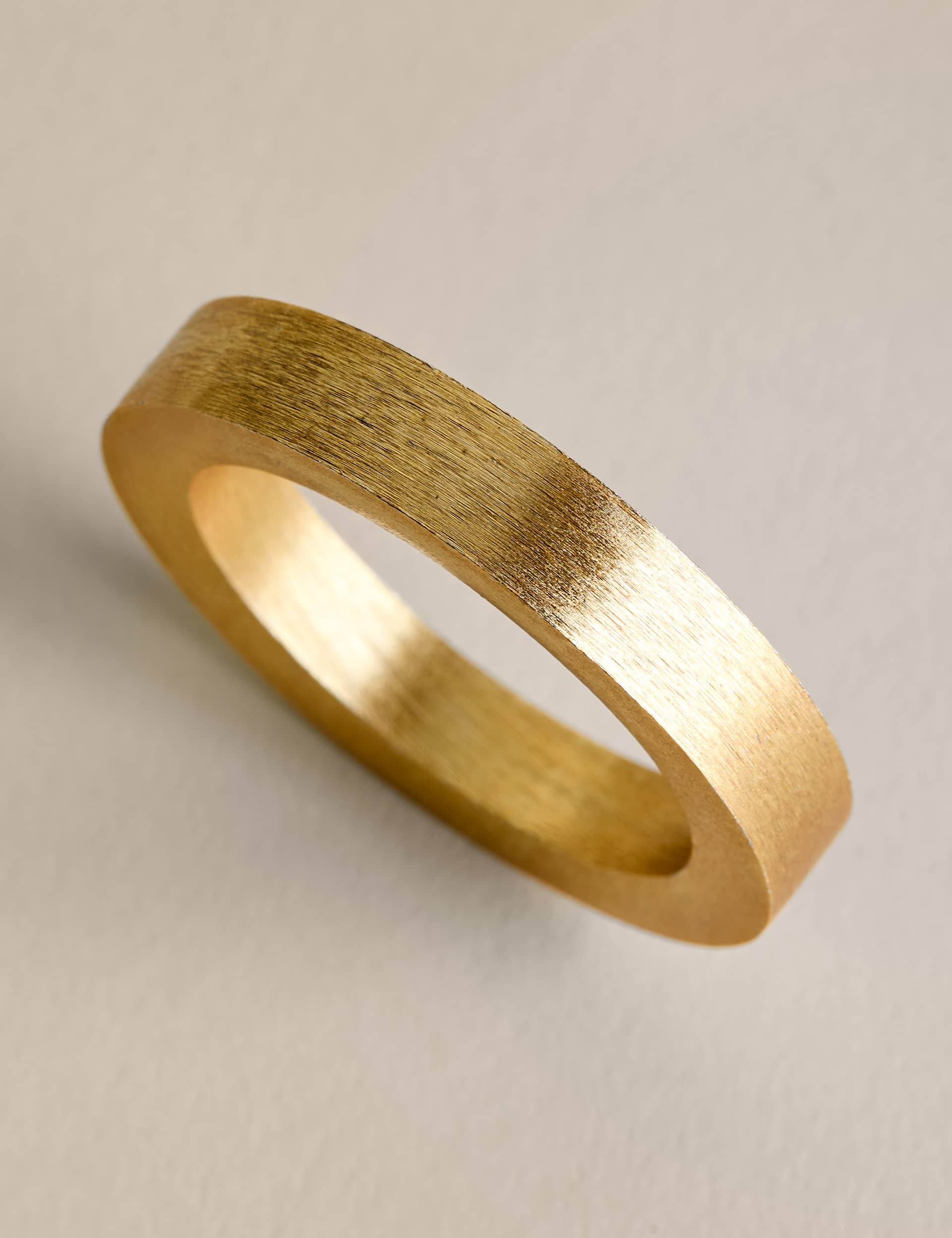 Set of four metallic napkin rings (British brand)
