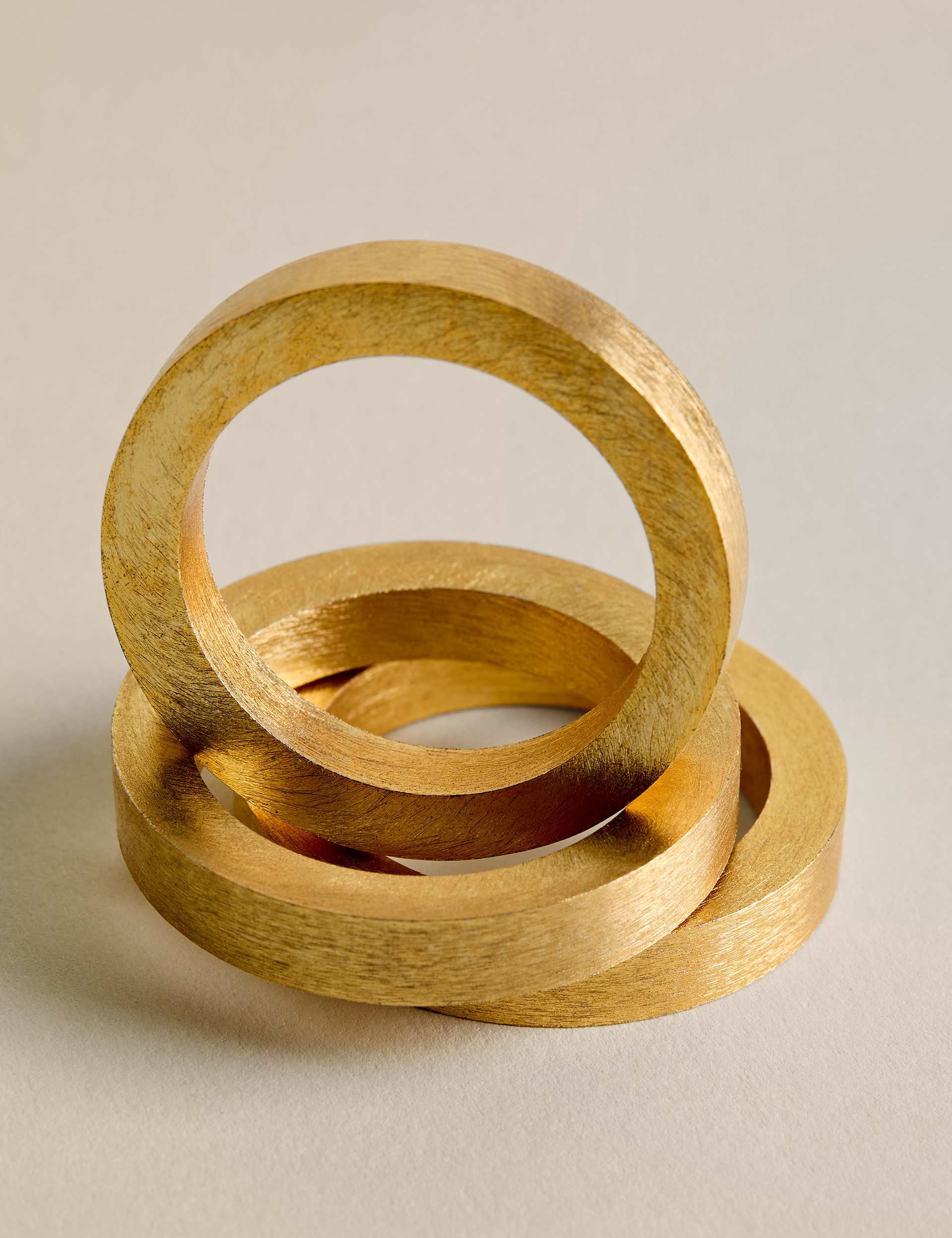 Set of four metallic napkin rings (British brand)