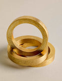 Set of four metallic napkin rings (British brand)