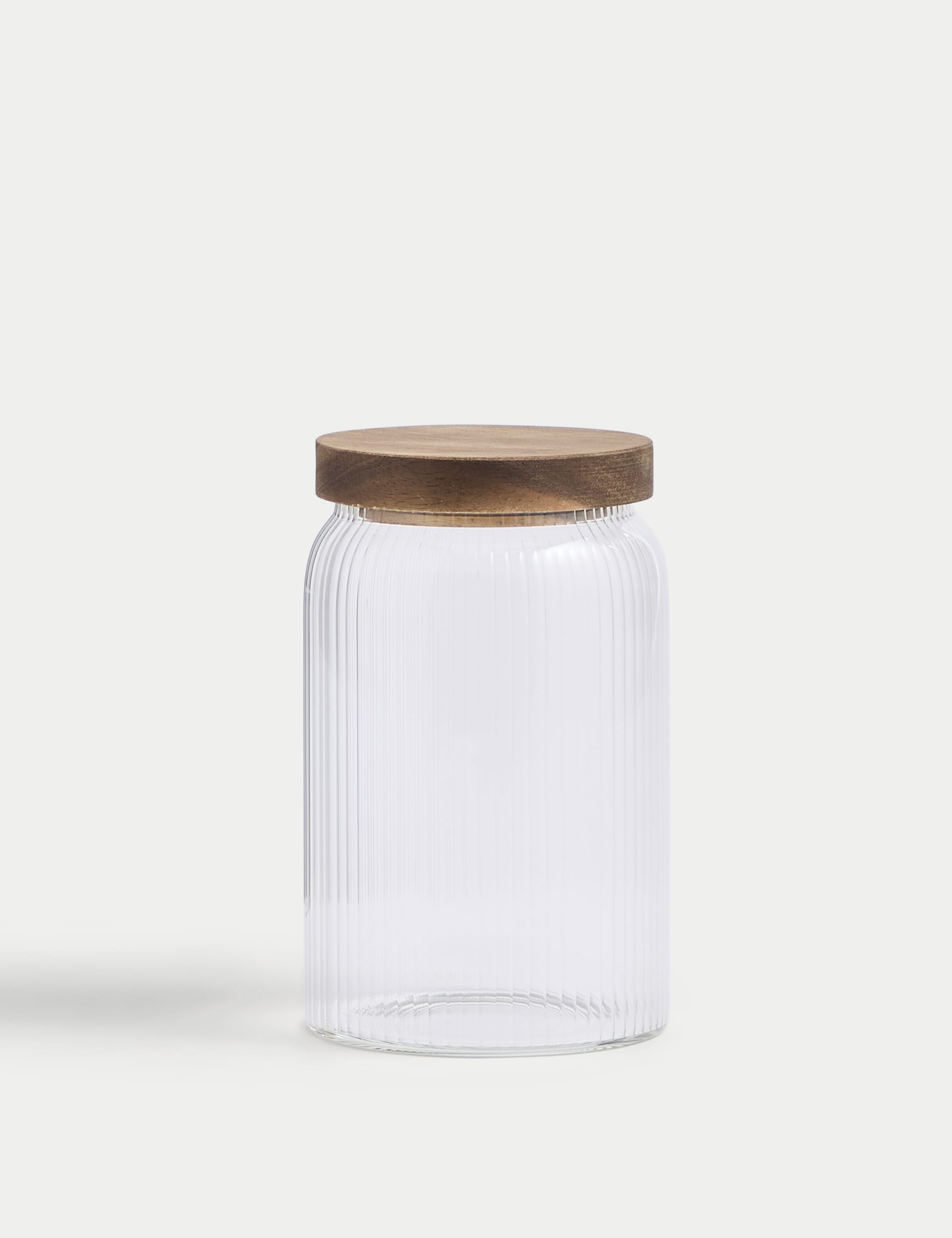 Medium ribbed glass storage jar with wooden lid, 16cm tall, imported from the UK