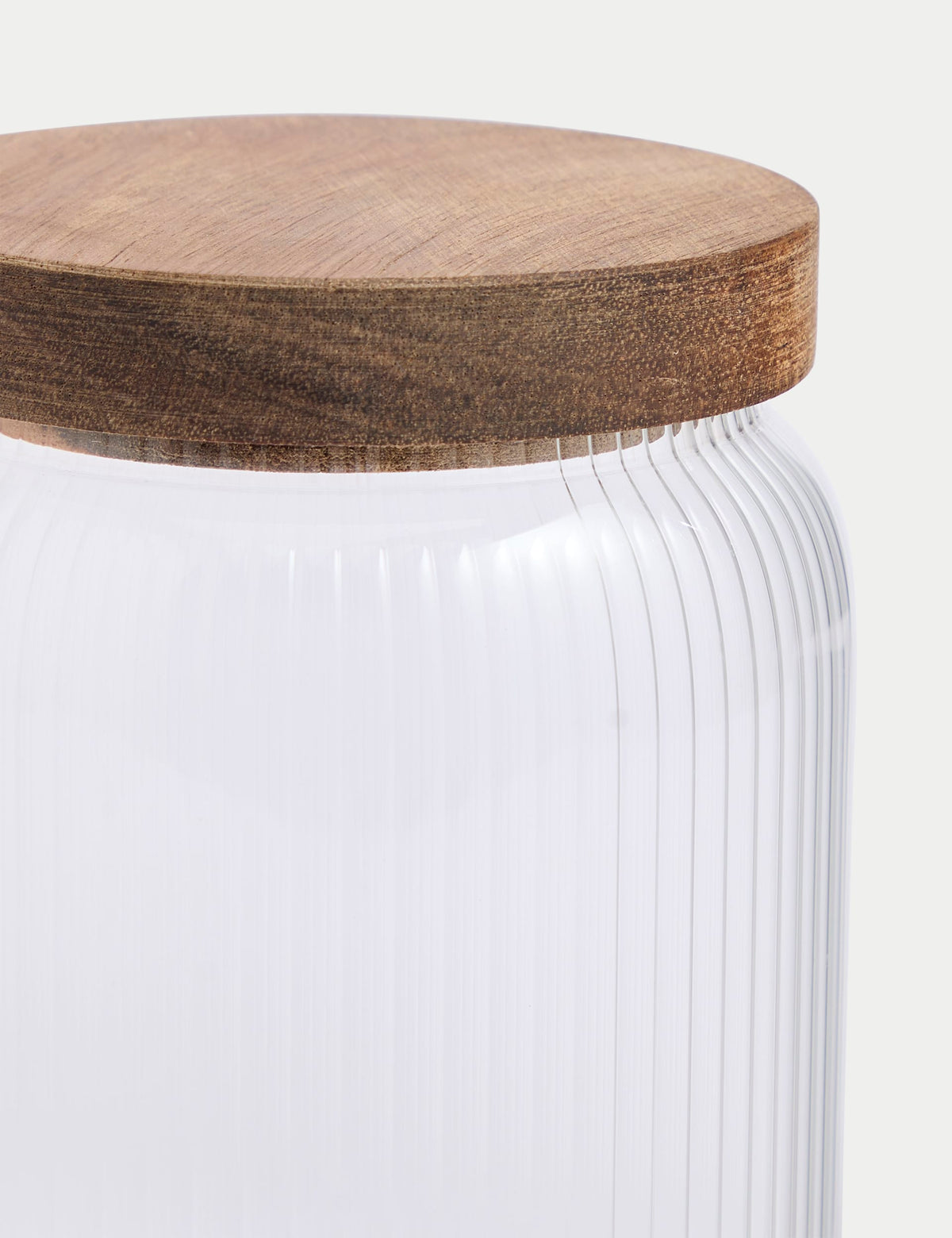 Medium ribbed glass storage jar with wooden lid, 16cm tall, imported from the UK