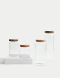 Medium ribbed glass storage jar with wooden lid, 16cm tall, imported from the UK