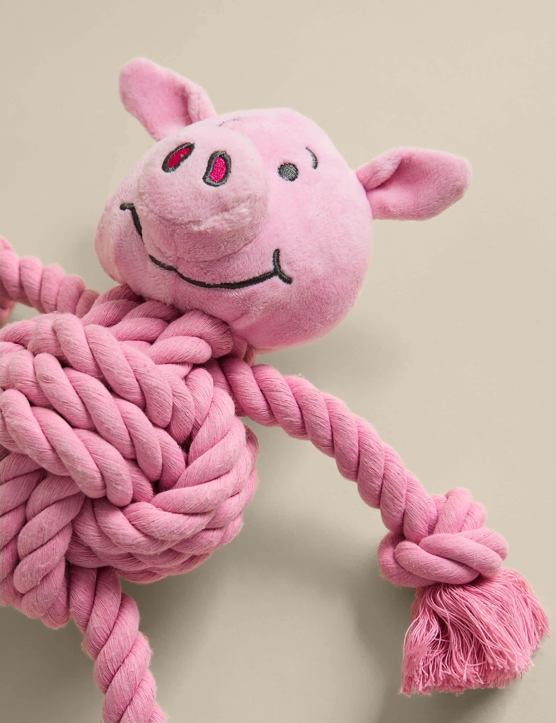 Percy Pig pet toy with rope limbs and squeaker - British product