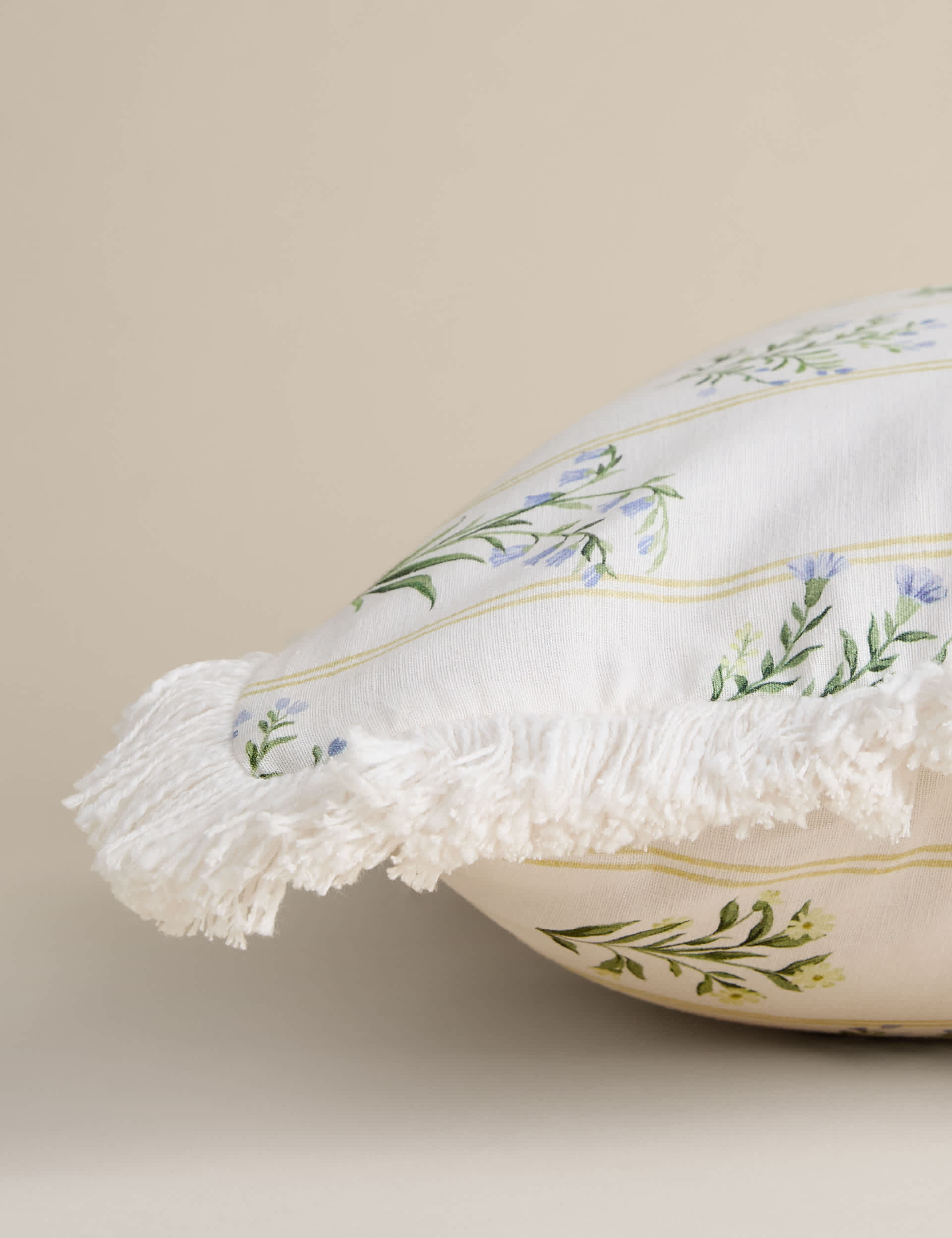 Cotton rich floral cushion with fringed edge, UK version