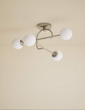 Parker flush ceiling light with metal frame and glass shades, imported from the UK