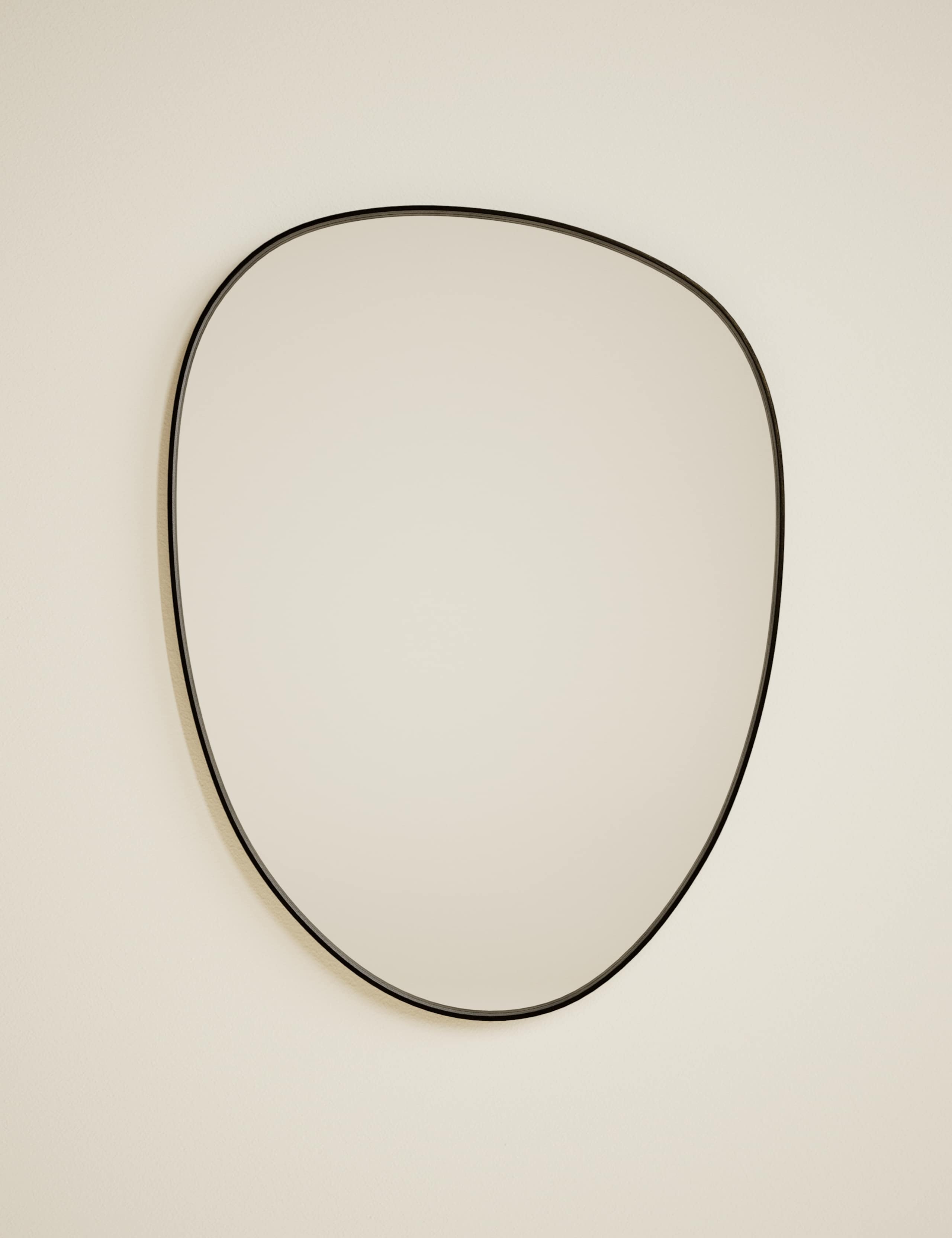 Pebble metal curved wall mirror, imported from the UK