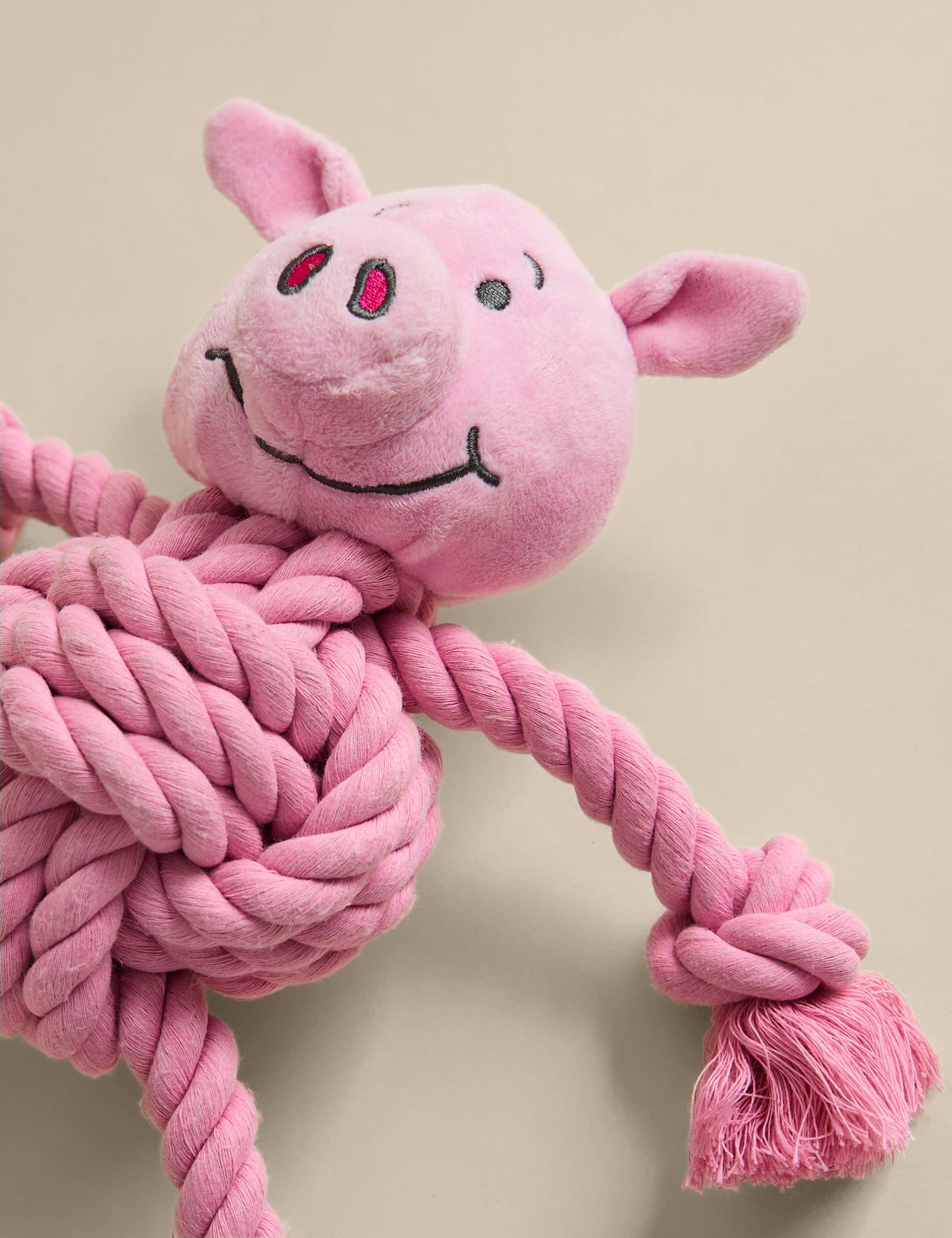 Percy Pig pet toy with rope limbs and squeaker - British product