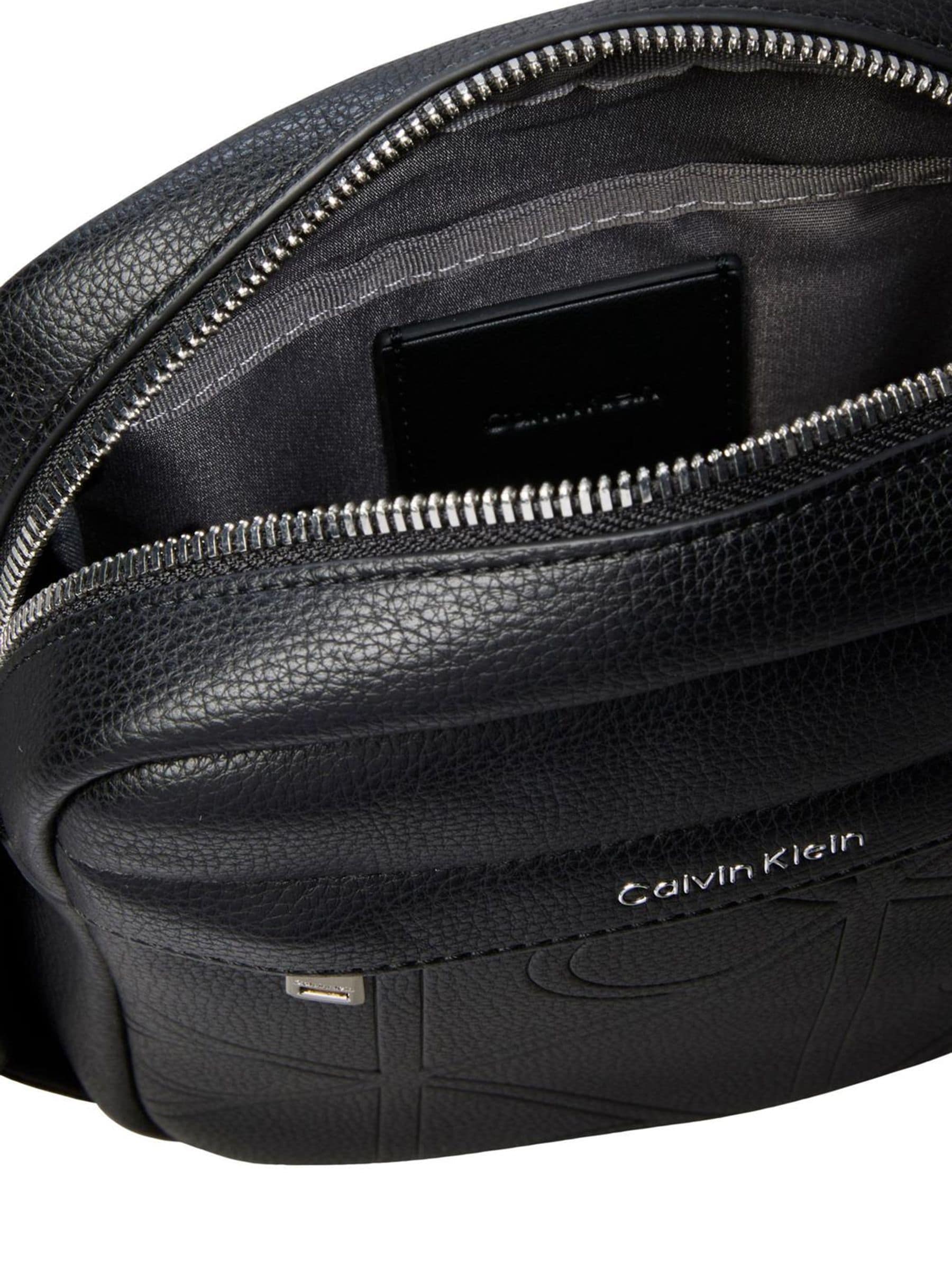 Calvin Klein black embossed emblem reporter bag, UK version