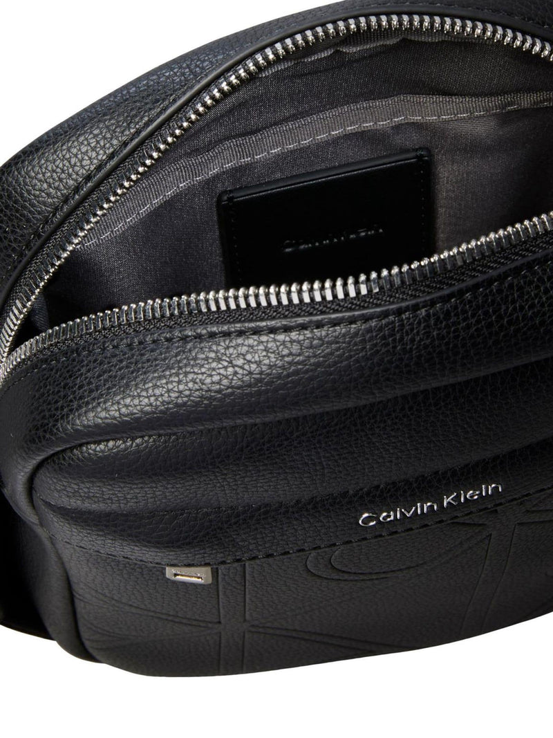 Calvin Klein black embossed emblem reporter bag, UK version