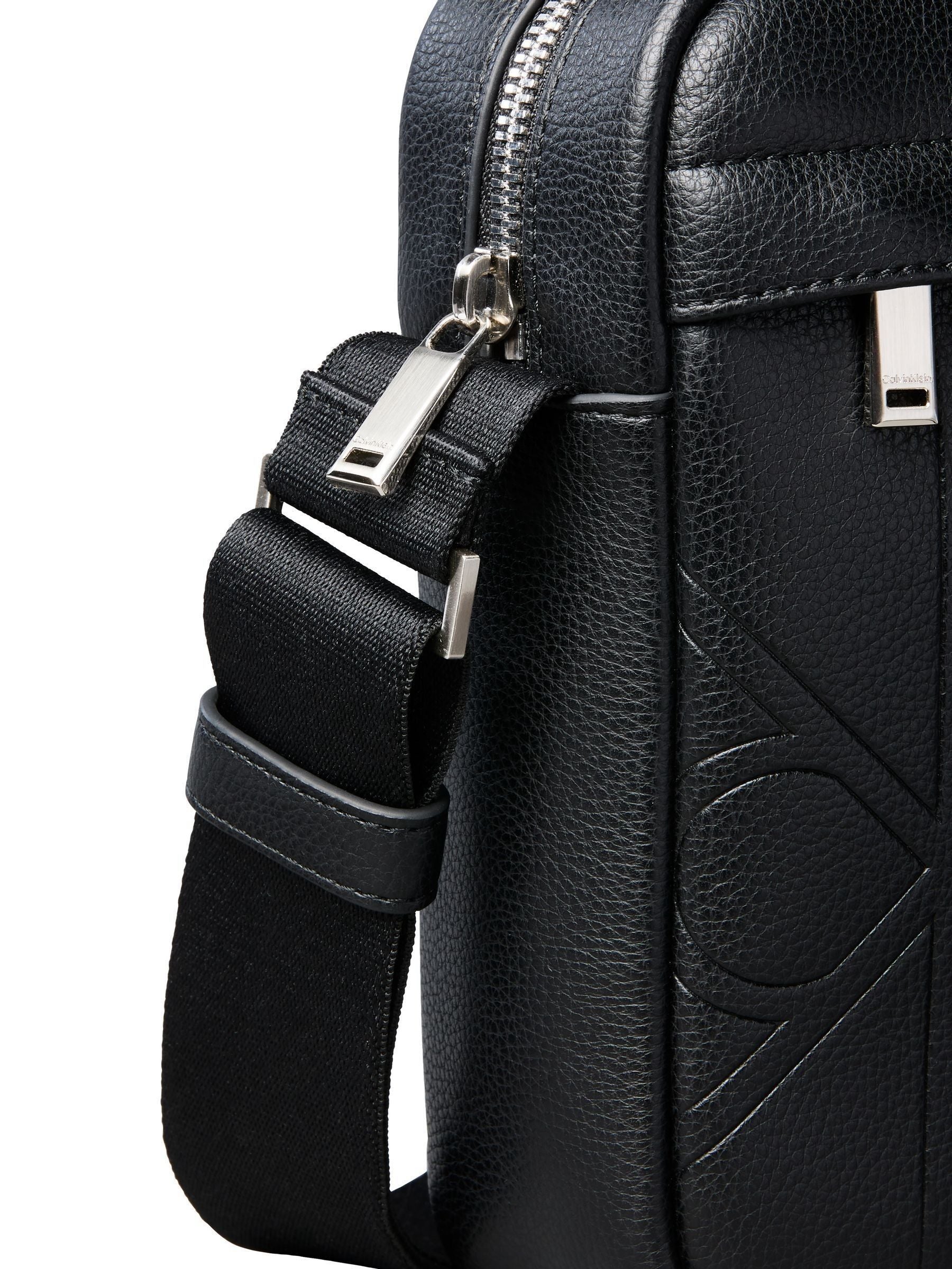 Calvin Klein black embossed emblem reporter bag, UK version
