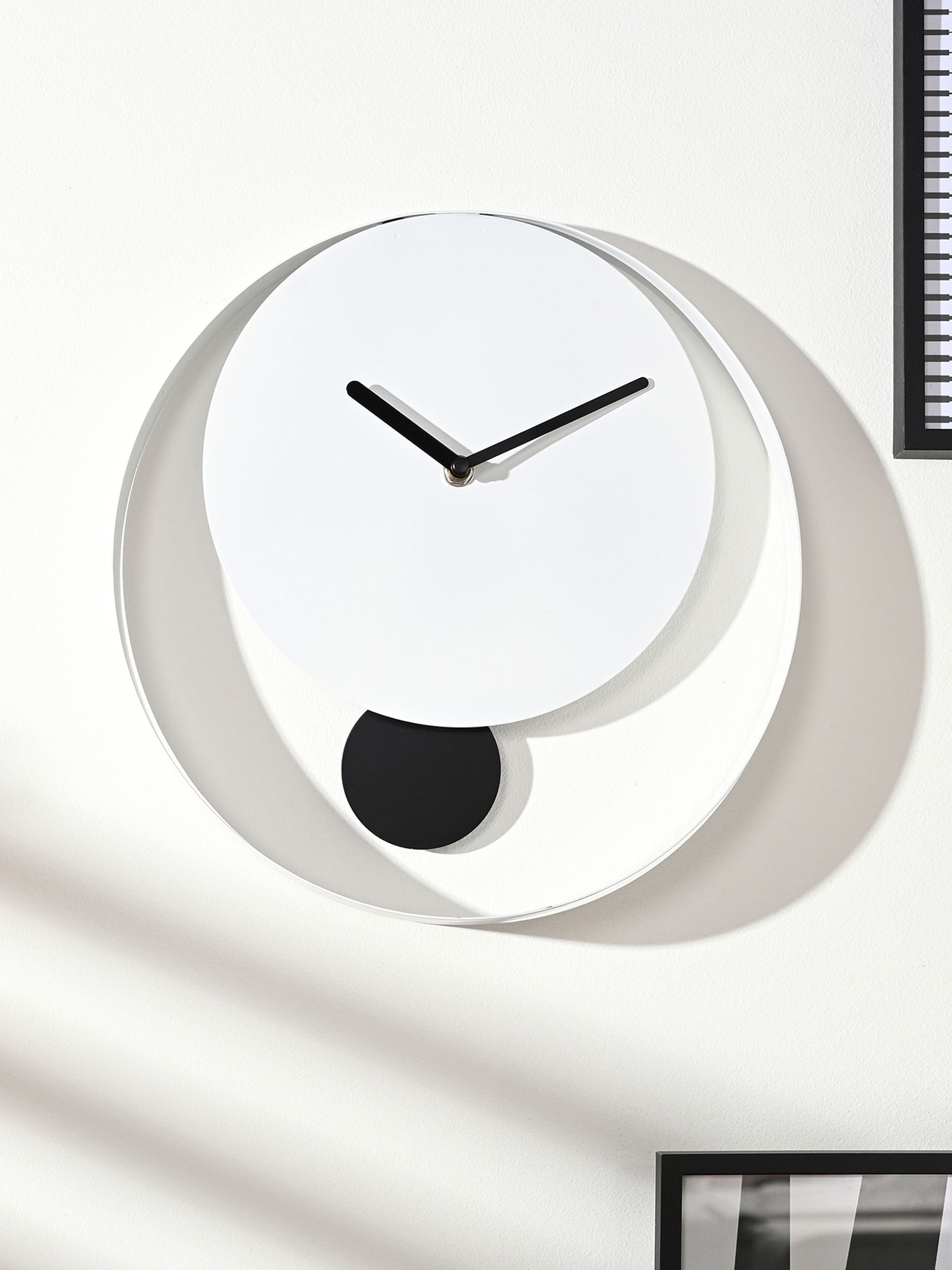 Widdop white pendulum wall clock with black hands (British brand)
