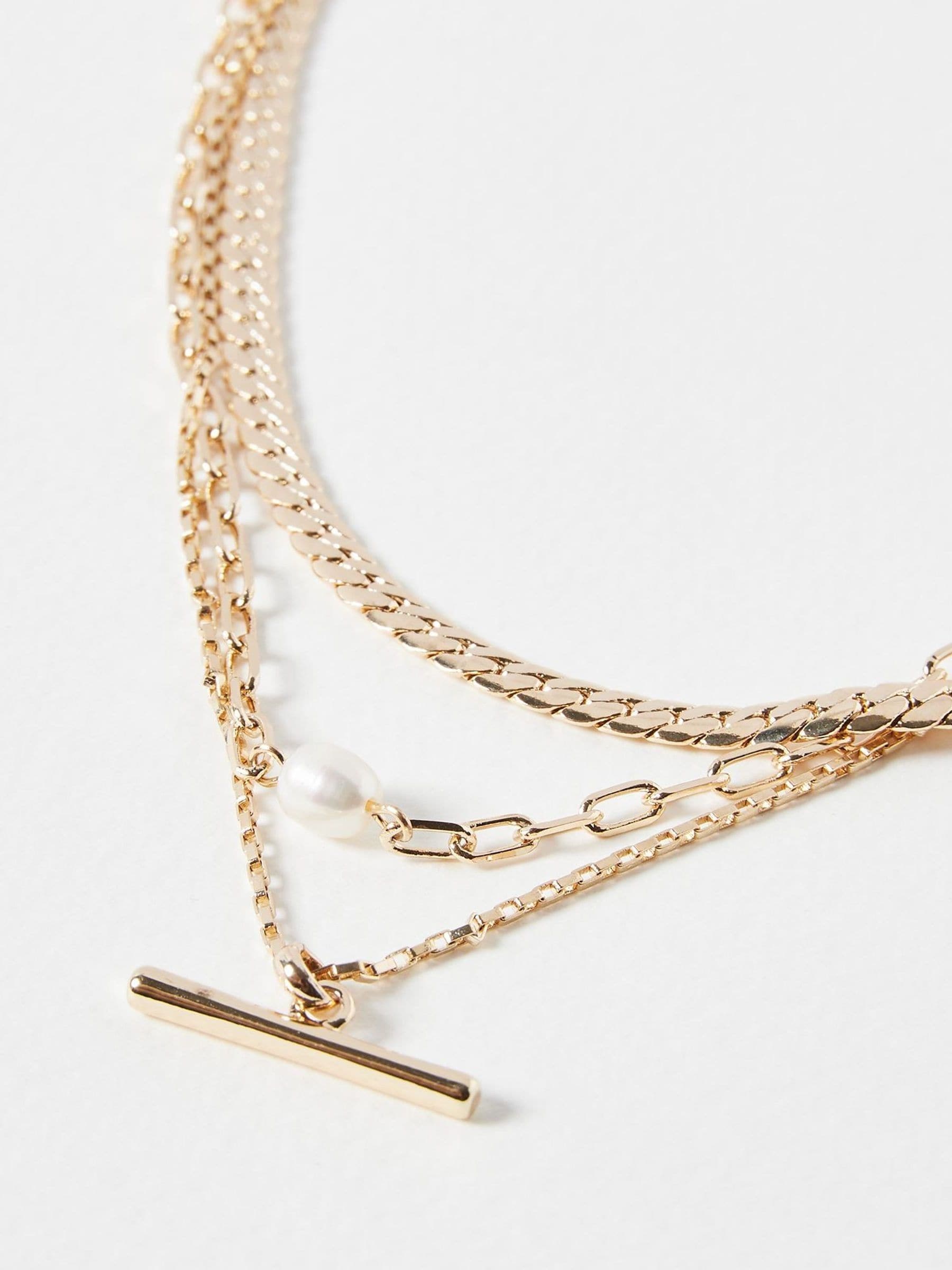 Oliver Bonas gold tone Rosalind chain freshwater pearl and bar layered necklace, imported from the UK