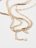 Oliver Bonas gold tone Rosalind chain freshwater pearl and bar layered necklace, imported from the UK