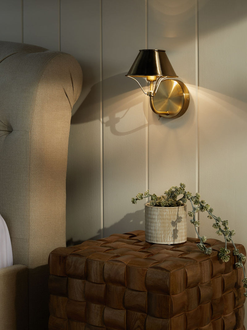 Brushed brass rechargeable wall light with warm white light, imported from the UK