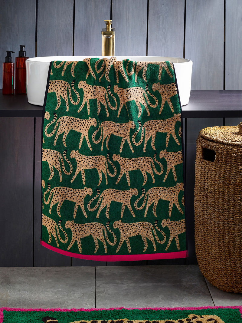100% cotton cheetah towel in green with pink trim, imported from the UK