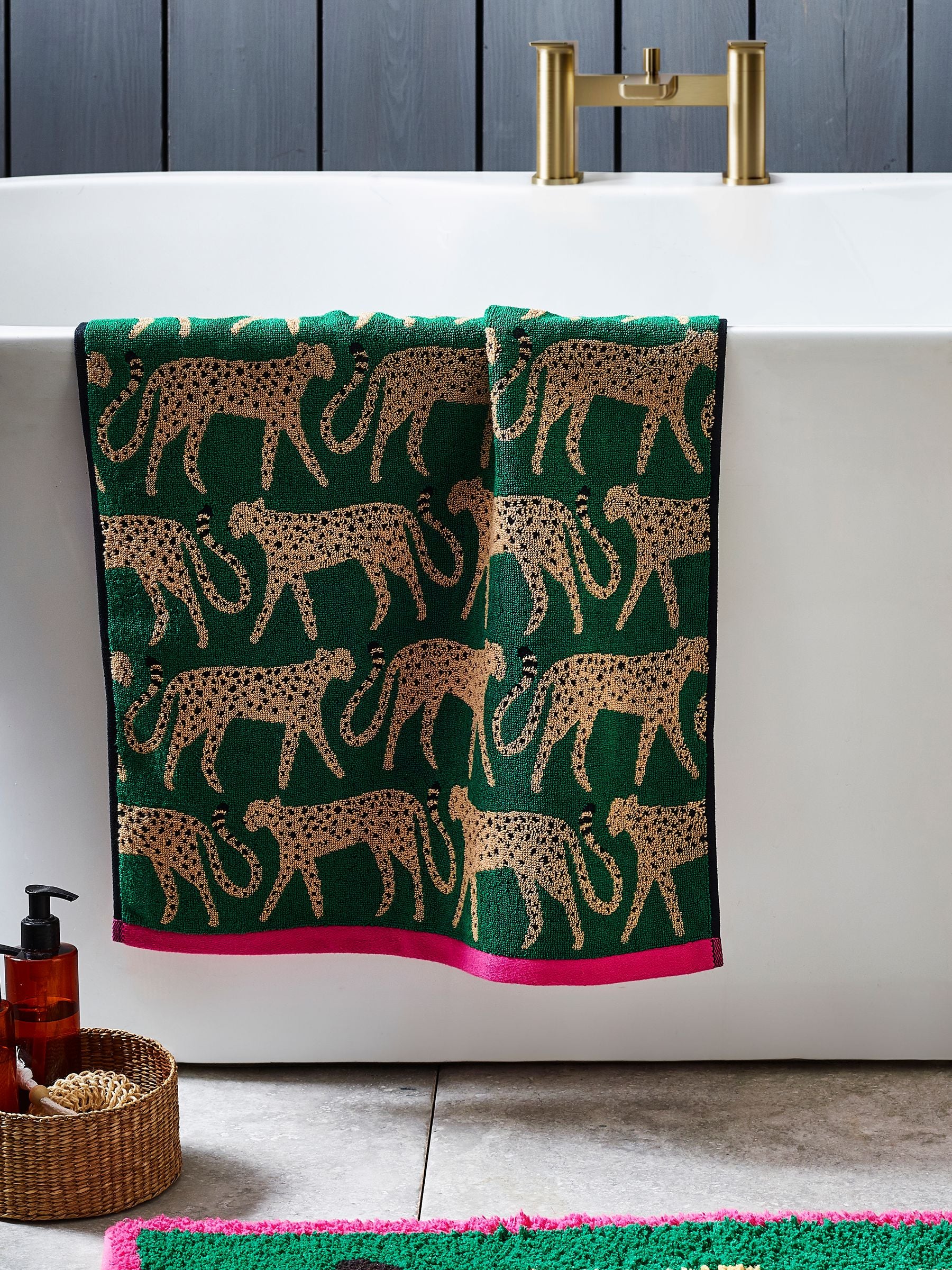 100% cotton cheetah towel in green with pink trim, imported from the UK