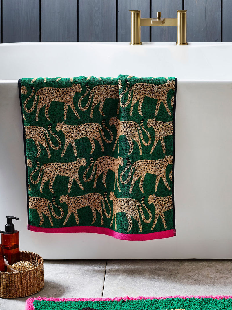 100% cotton cheetah towel in green with pink trim, imported from the UK
