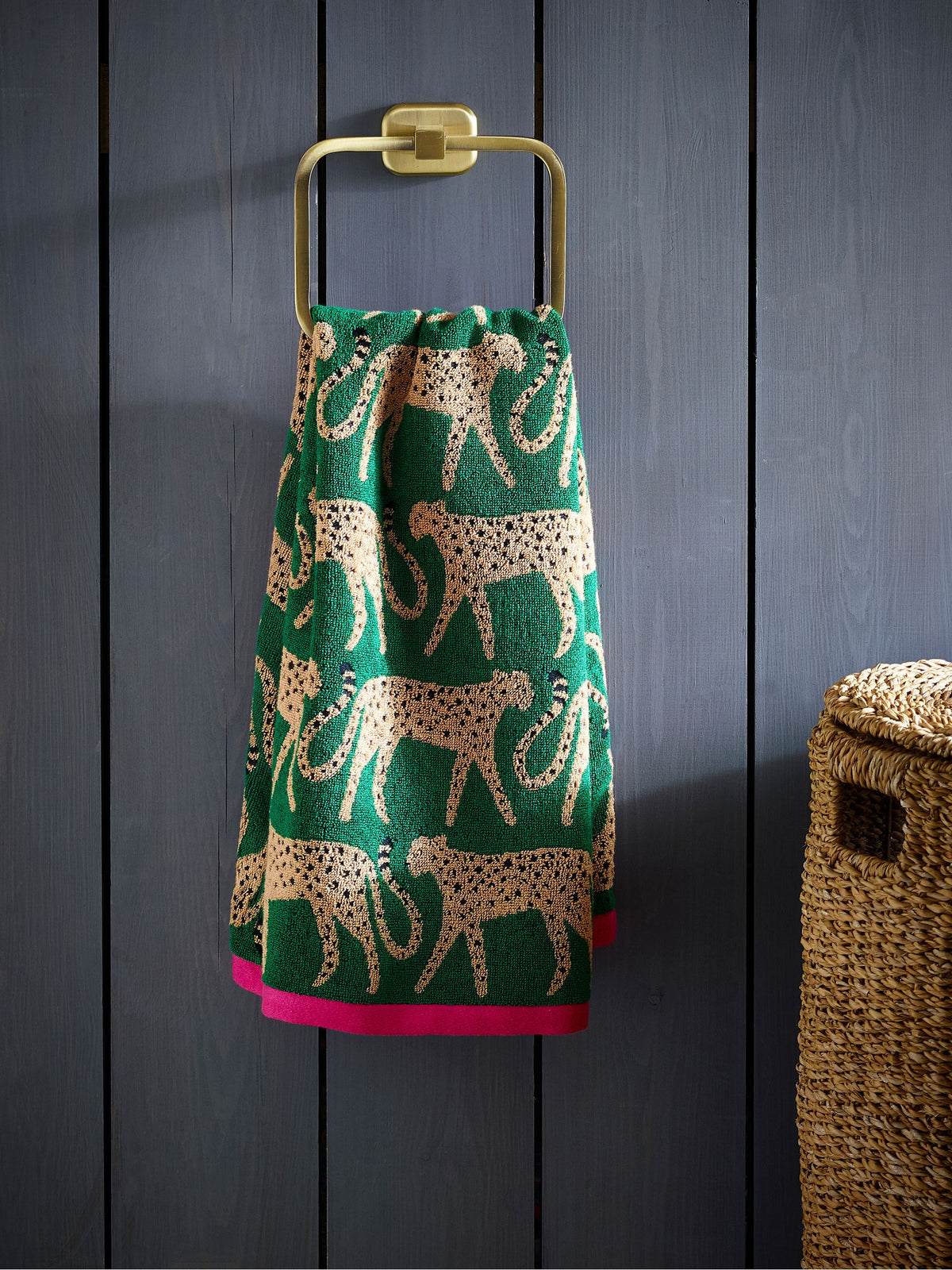100% cotton cheetah towel in green with pink trim, imported from the UK