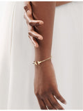 Tiffany & Co. T Wire bracelet 18ct yellow gold, UK version