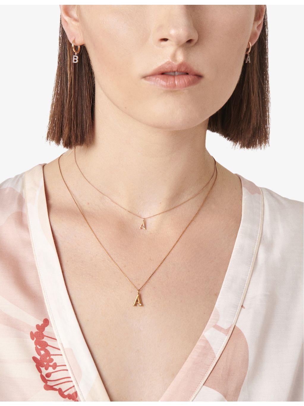 Selda J initial 14ct rose gold huggie earring, imported from the UK