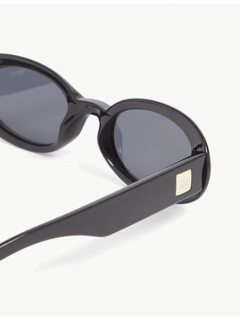 Le Specs oval-frame sunglasses with smoke tint lenses, imported from the UK