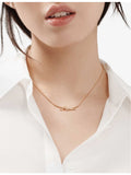 Tiffany & Co. 0.25ct diamond rose-gold knot pendant, imported from the UK