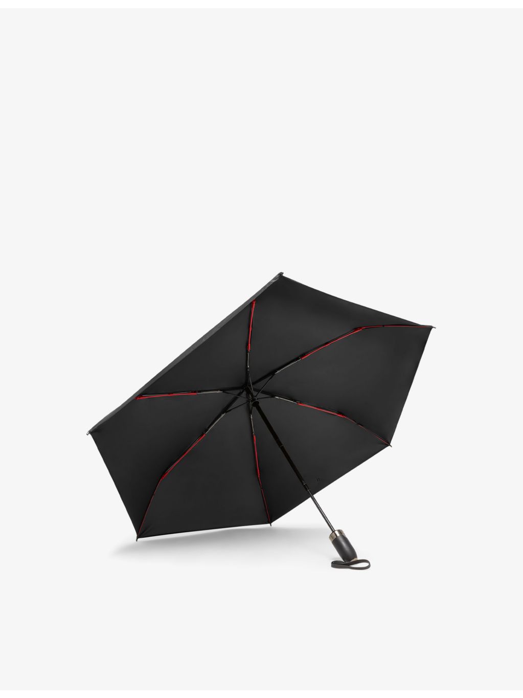 TUMI logo-print shell umbrella in medium size, imported from the UK
