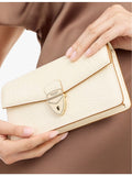 Aspinal of London Mayfair leather clutch with gold hardware, UK version
