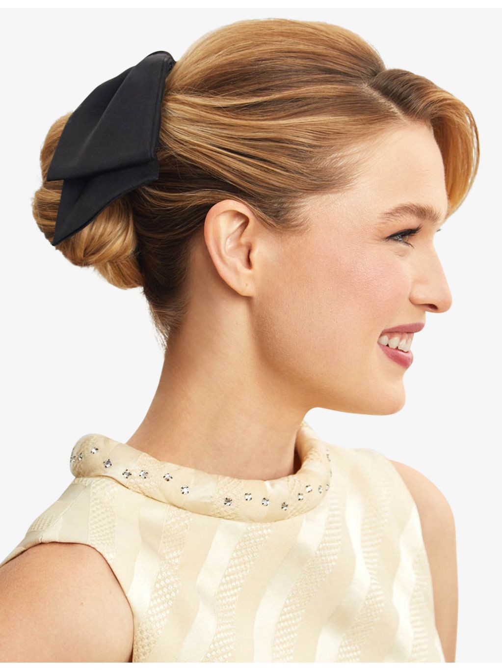 Kitsch bow-shaped fabric hair clip with oversized bow, imported from the UK