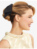 Kitsch bow-shaped fabric hair clip with oversized bow, imported from the UK
