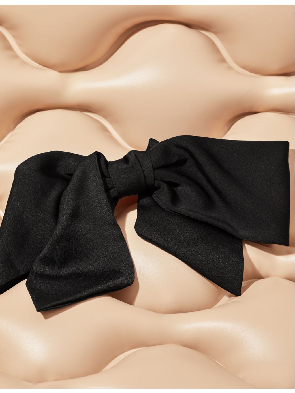 Kitsch bow-shaped fabric hair clip with oversized bow, imported from the UK