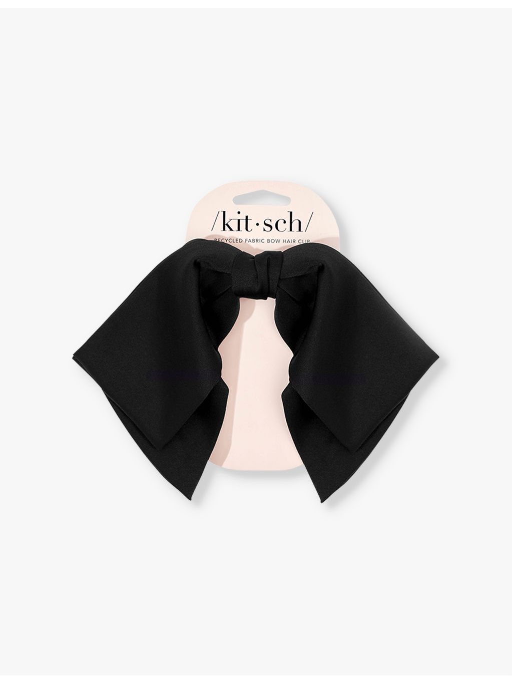 Kitsch bow-shaped fabric hair clip with oversized bow, imported from the UK