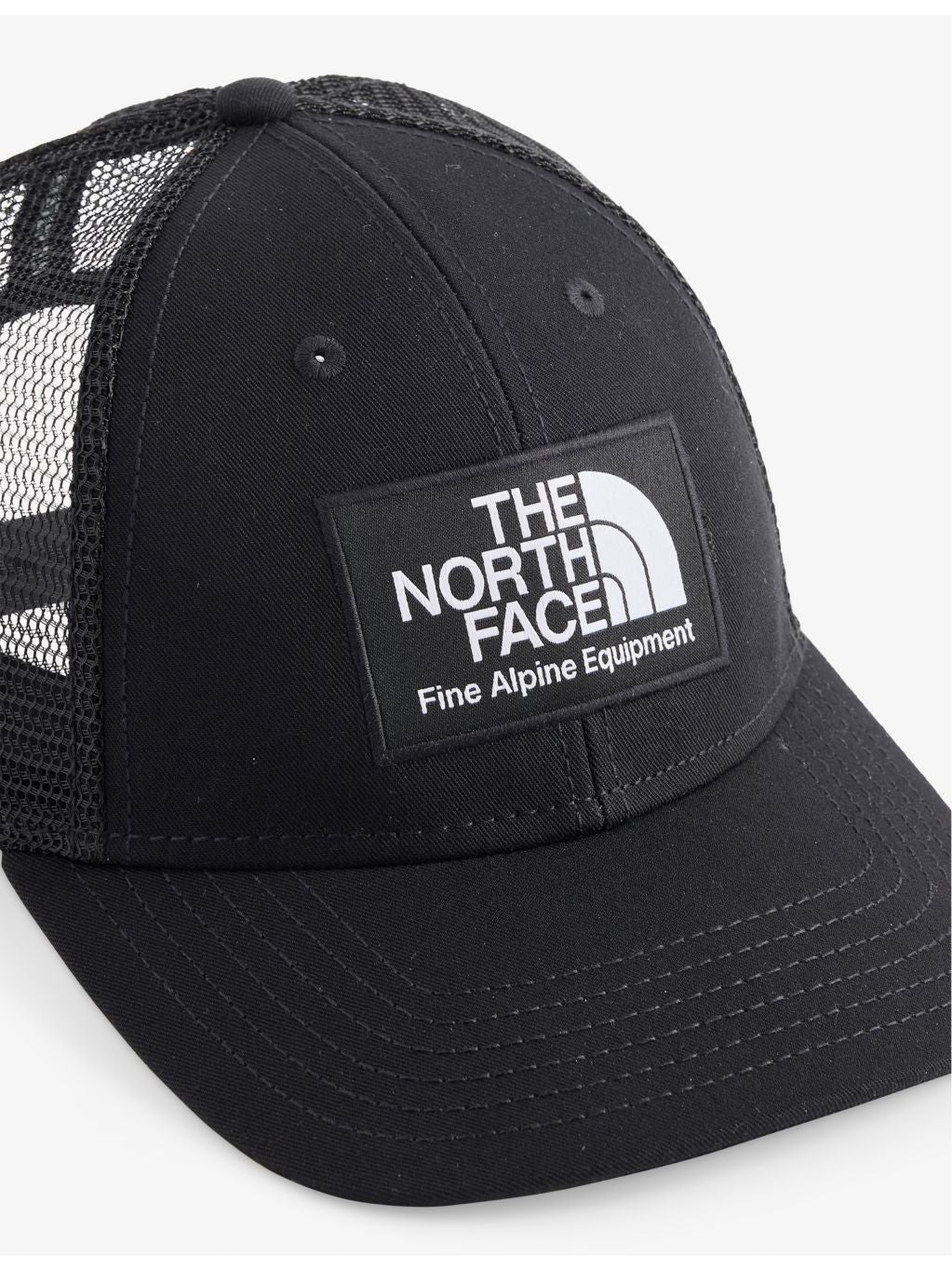 The North Face Mudder woven trucker cap, imported from the UK