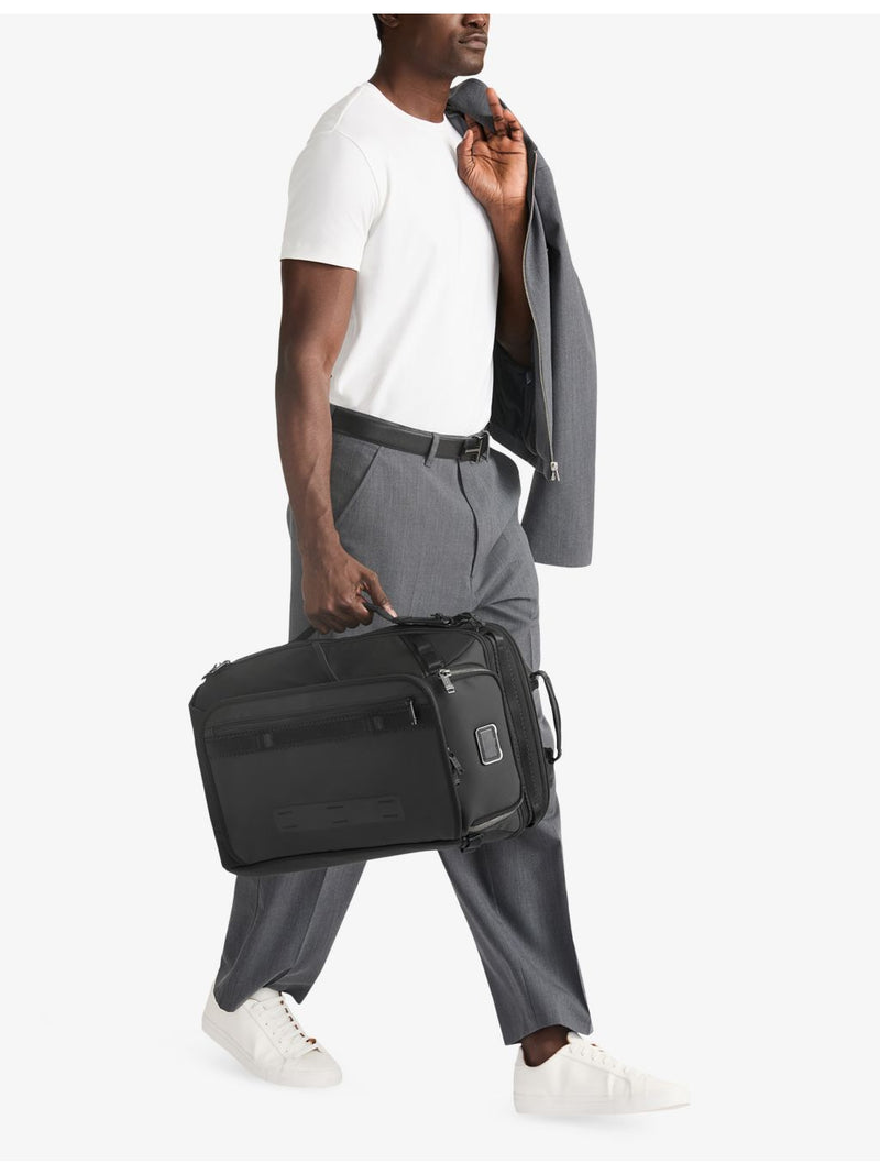 Tumi Detrick woven backpack with side handle, imported from the UK