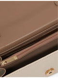 Dune lizard-embossed faux-leather top-handle bag - British product