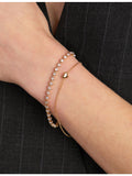 Astrid & Miyu heart bezel tennis bracelet in gold-plated brass, UK version