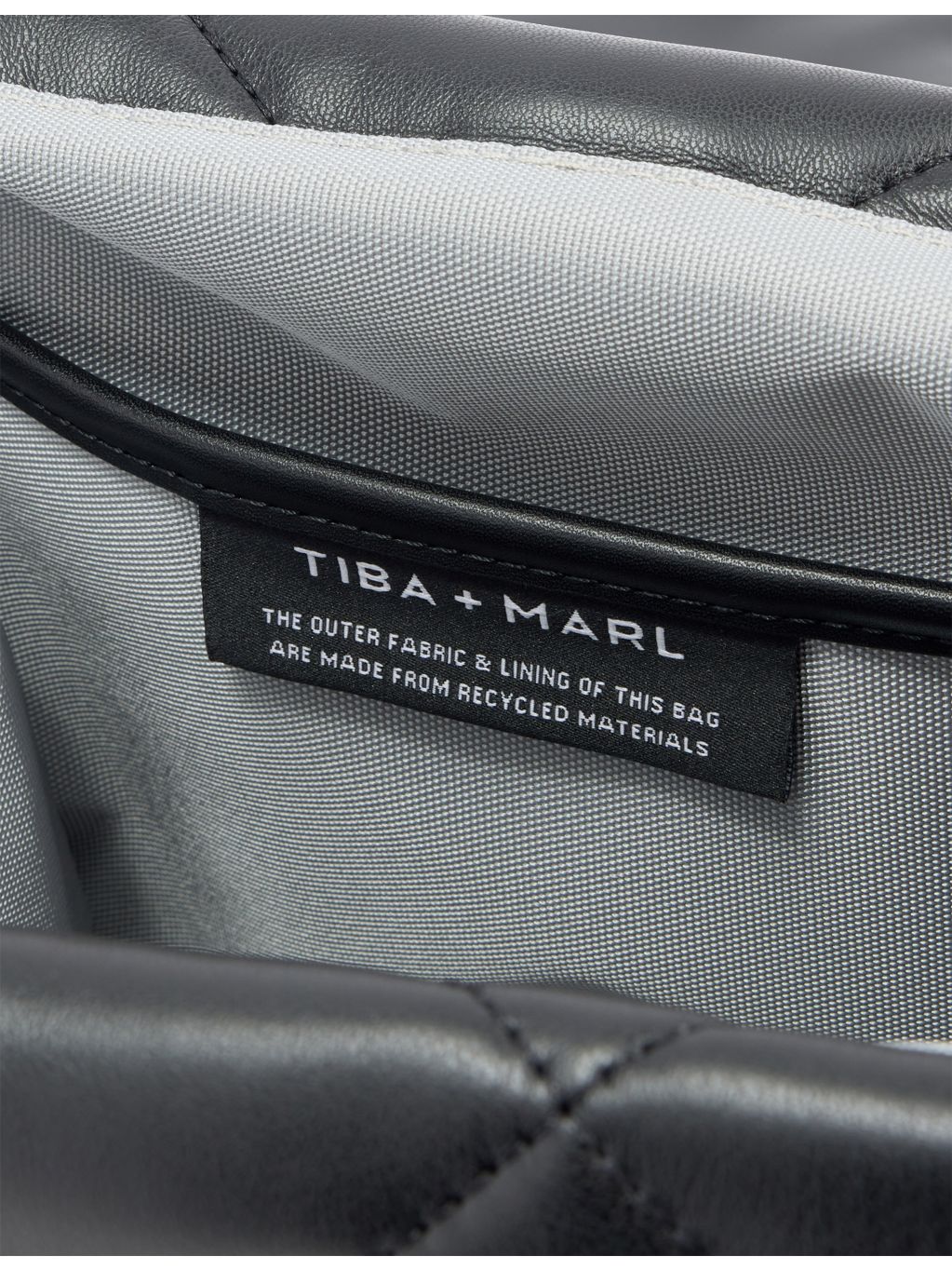 Tiba + Marl quilted faux leather changing bag, imported from the UK