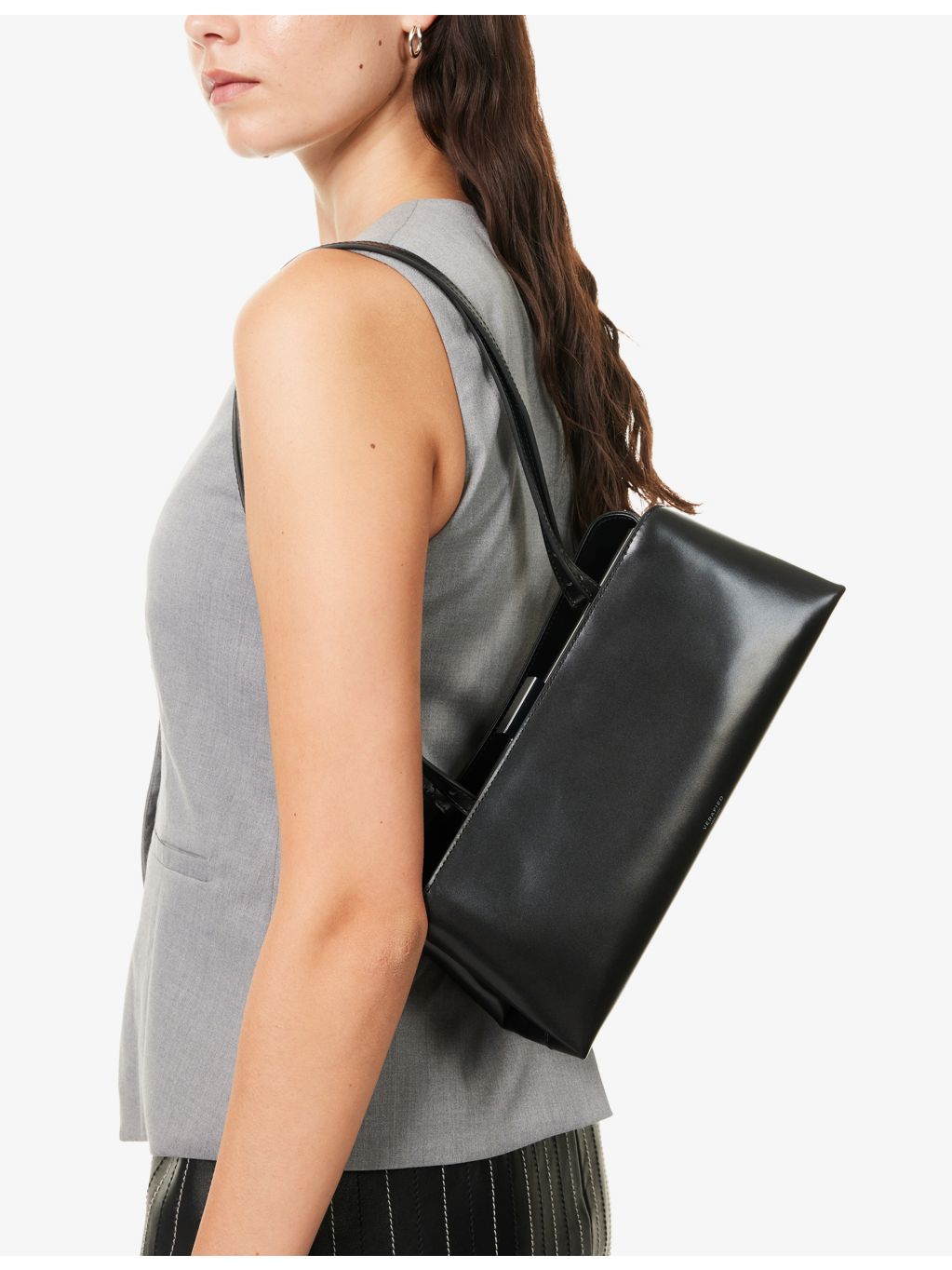 Verafied leather clutch bag with interchangeable straps, British brand