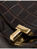 Toteme croco leather clutch bag with T-lock and gold hardware, UK version
