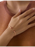 Piaget Possession 18ct rose gold bangle with carnelian cabochons - British product