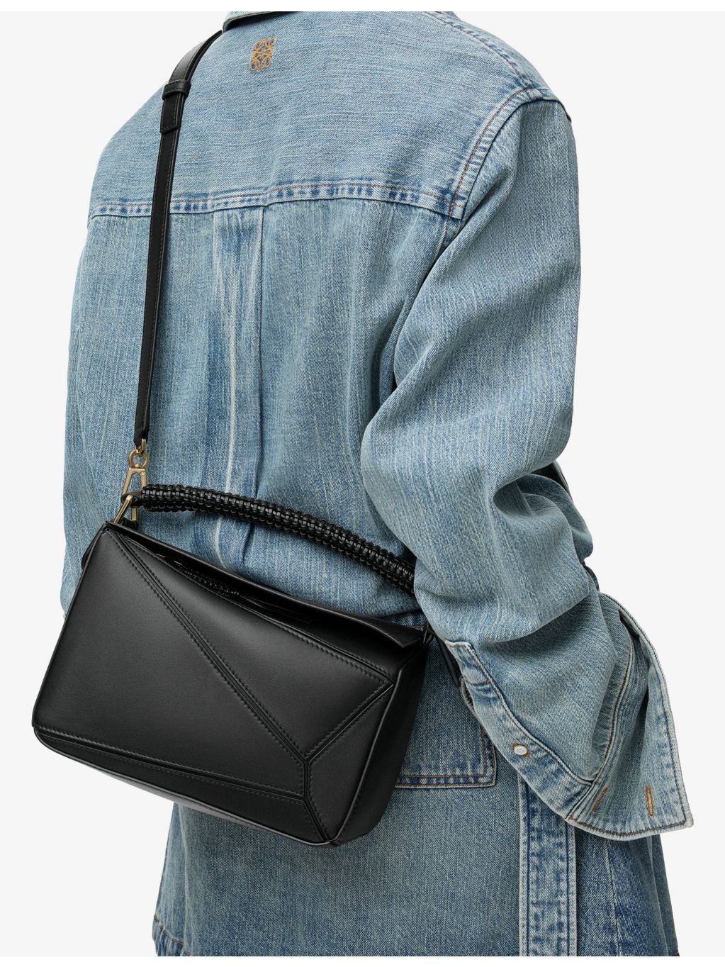 Loewe leather cross-body bag with woven handle (British brand)