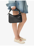 Loewe leather cross-body bag with woven handle (British brand)