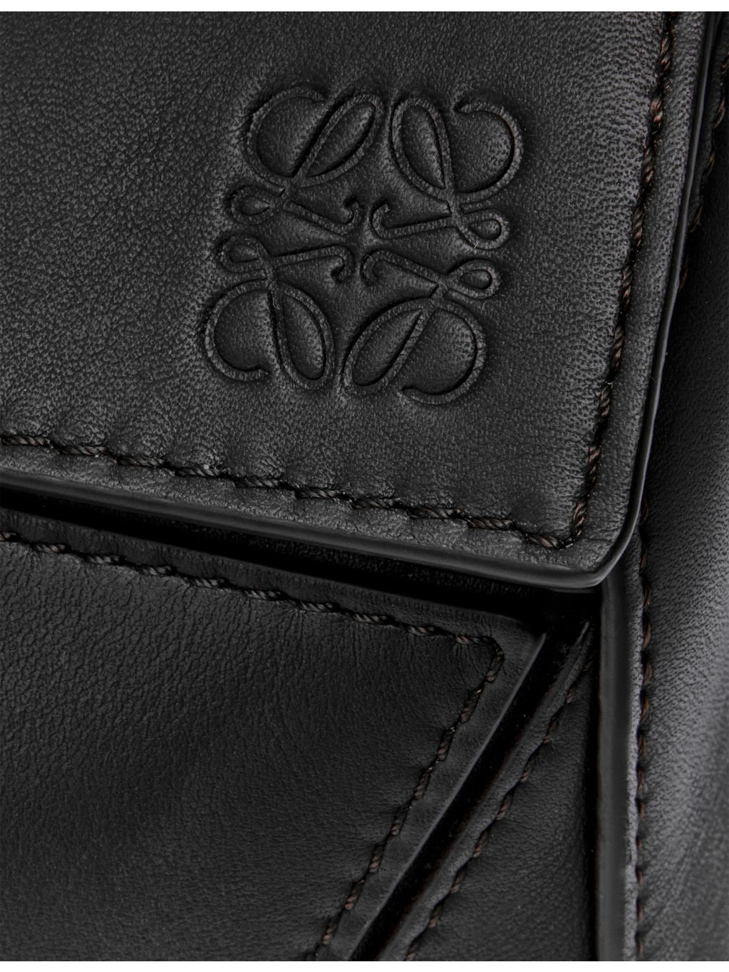 Loewe leather cross-body bag with woven handle (British brand)